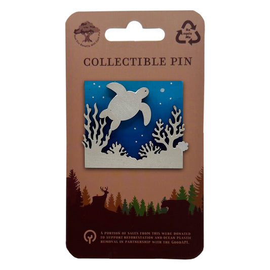 Collectible pin packaging with a turtle design on a blue background
