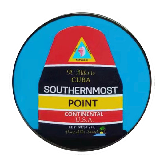 Southernmost Point Buoy Key West enamel pin on pastel waterfront backing card with houses and palm trees