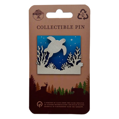 Collectible pin packaging with a turtle design on a blue background