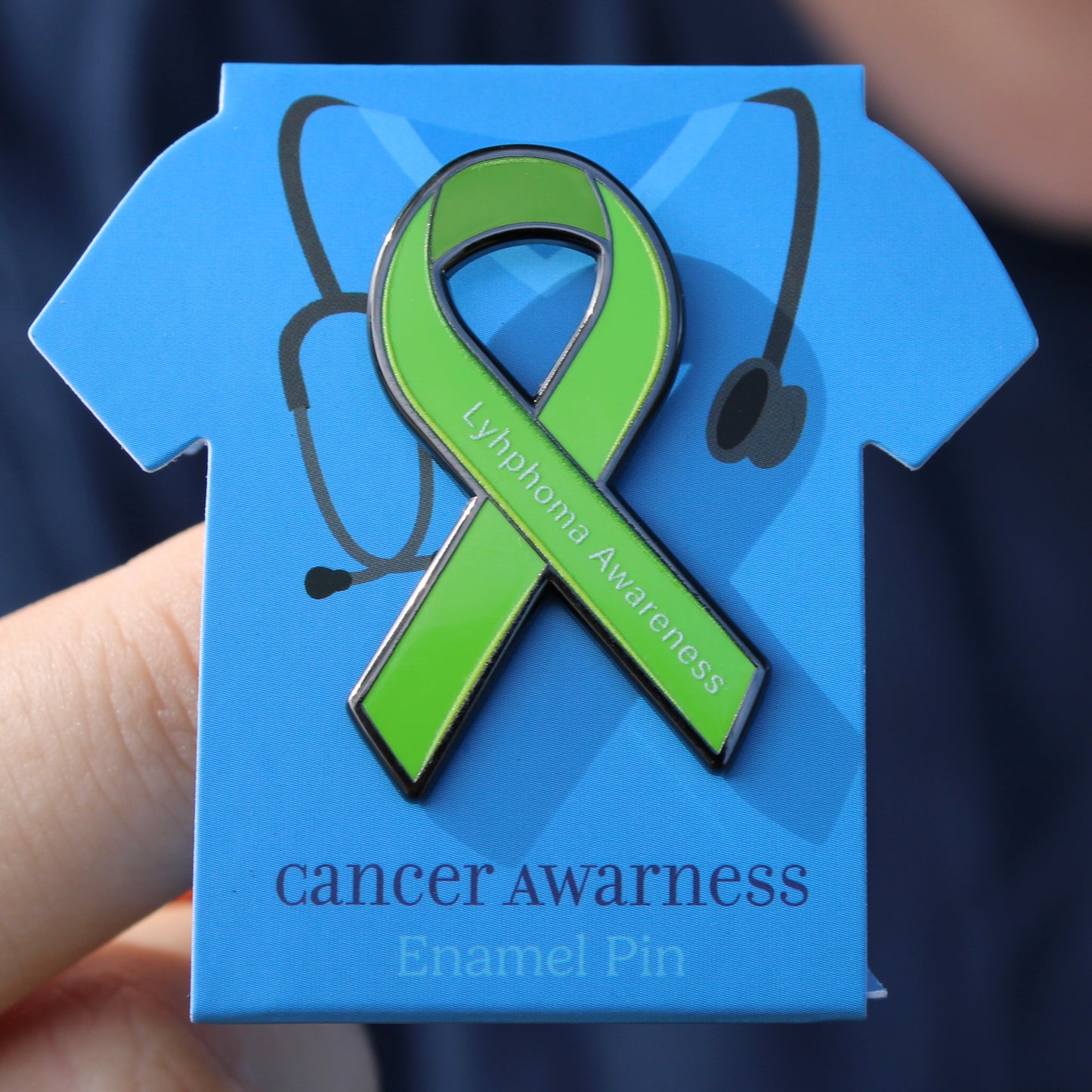 Green Lymphoma Awareness ribbon enamel pin on a blue card with 'Cancer Awareness' text