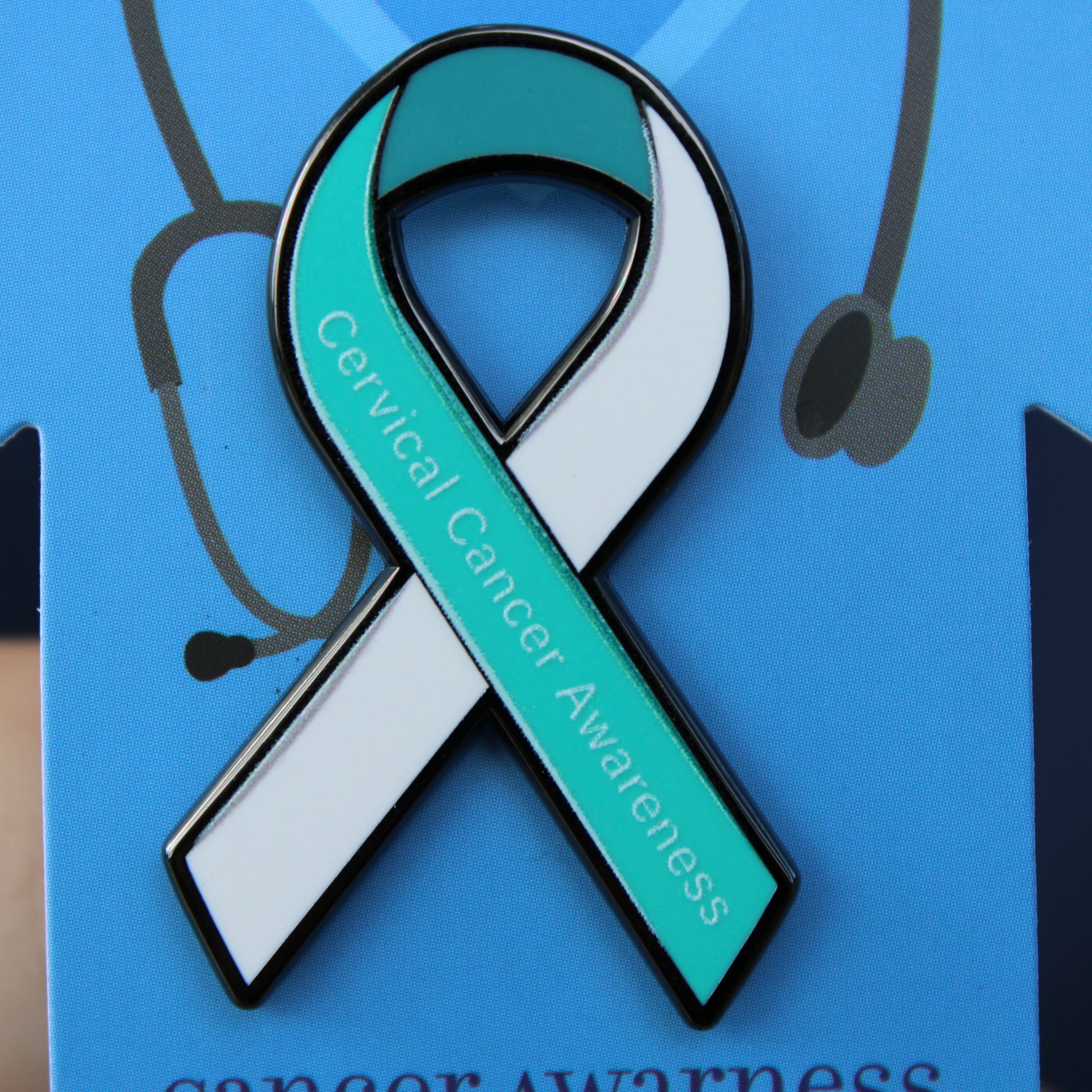Blue scrub backing card with cervical cancer awareness ribbon displayed on front