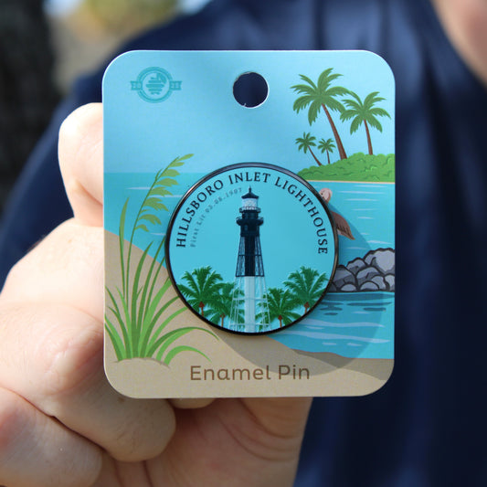 Hillsboro Inlet Lighthouse enamel pin on a card held by a person