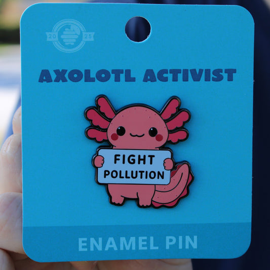 Axolotl enamel pin on a blue card with 'Fight Pollution' message