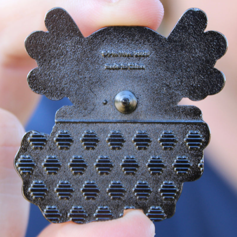 axolotl enamel pin back stamp with raised pin hive logo and text reading "pin hive 2025" "made in china"