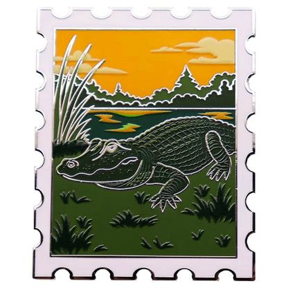 American alligator postage stamp enamel pin with Everglades sunset scene