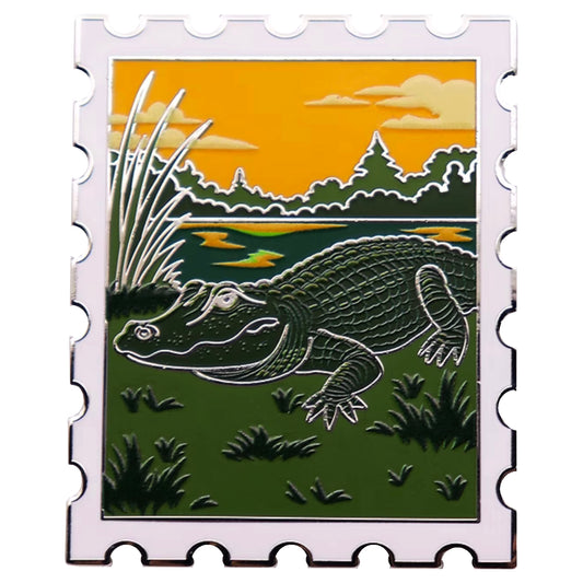 American alligator postage stamp enamel pin with Everglades sunset scene