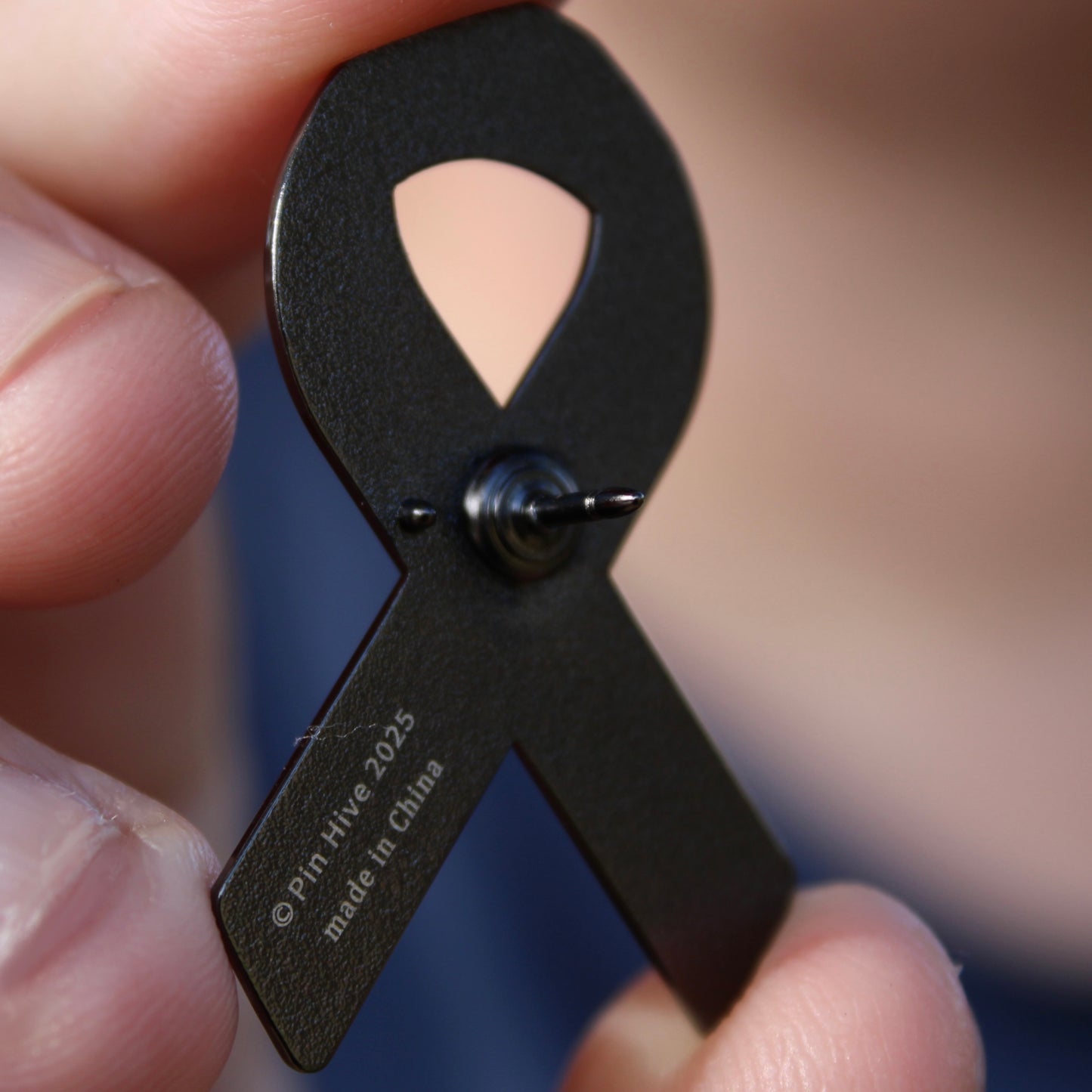 cancer awareness enamel pin back stamp and logo with font "pin hive 2025, made in china"