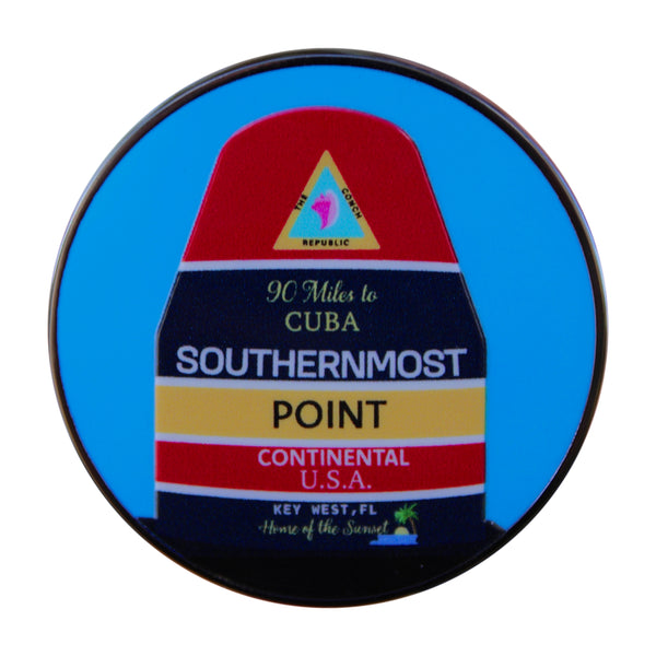 Round sign with 'Southernmost Point' text and colorful design on a blue background