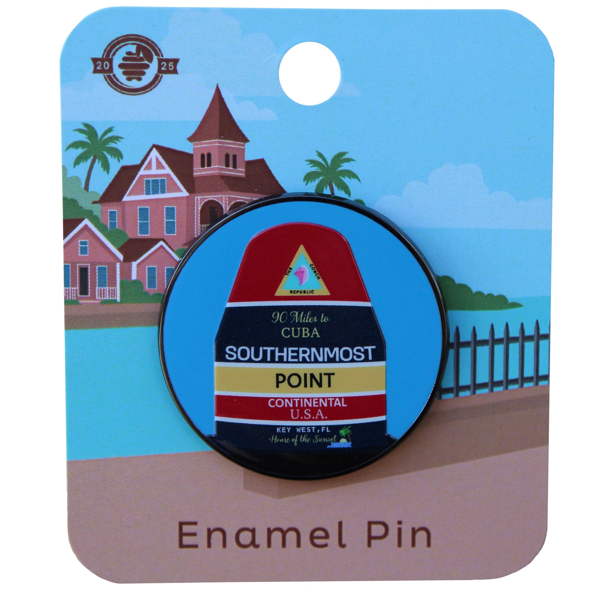 Enamel pin with Southernmost Point design on a card with a scenic background of the key west customs house