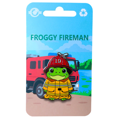 Froggy Fireman enamel pin on blue backing card with fire truck in background
