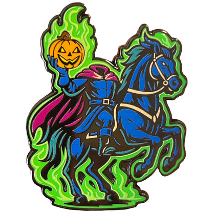 Headless Horseman enamel pin riding through Sleepy Hollow holding a jack-o’-lantern